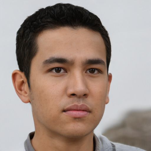 Neutral white young-adult male with short  black hair and brown eyes