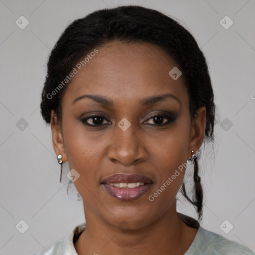 Joyful black young-adult female with short  brown hair and brown eyes
