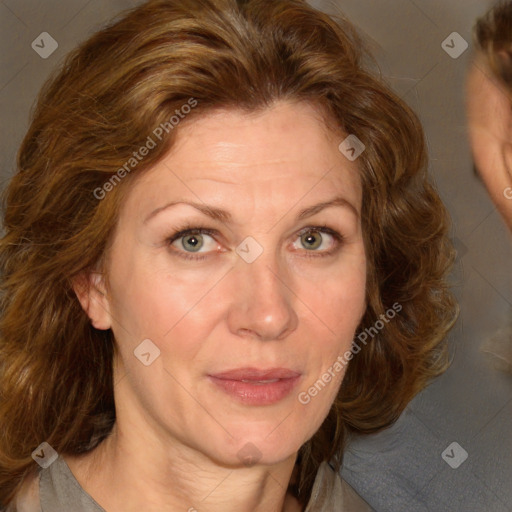 Joyful white adult female with medium  brown hair and green eyes