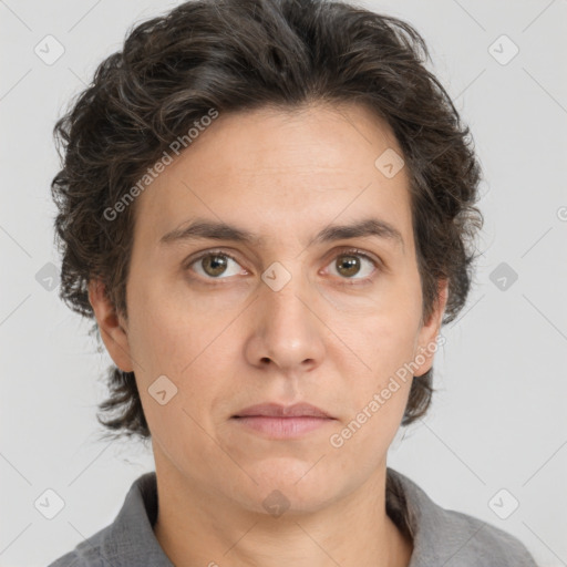 Joyful white adult male with medium  brown hair and brown eyes