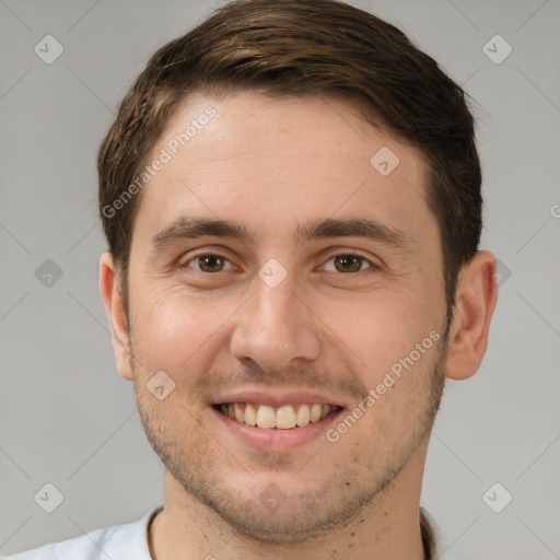 Joyful white young-adult male with short  brown hair and brown eyes