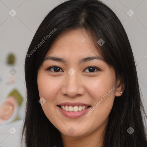 Joyful asian young-adult female with long  brown hair and brown eyes