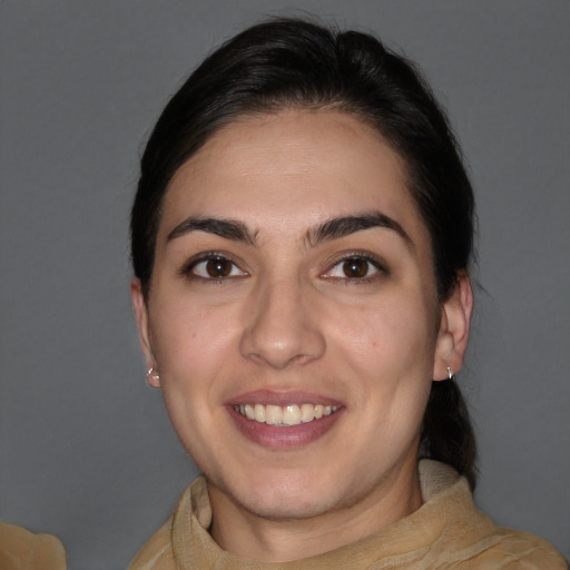 Joyful white young-adult female with medium  brown hair and brown eyes