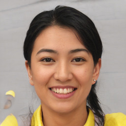 Joyful latino young-adult female with medium  brown hair and brown eyes