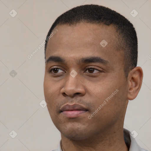 Neutral black young-adult male with short  black hair and brown eyes