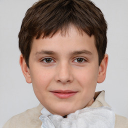 Joyful white child male with short  brown hair and brown eyes