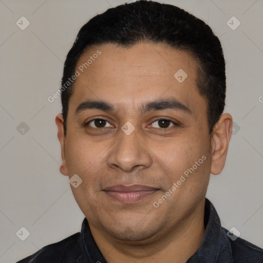 Joyful latino young-adult male with short  black hair and brown eyes