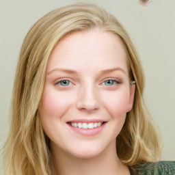Joyful white young-adult female with long  brown hair and blue eyes