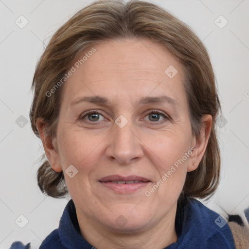 Joyful white adult female with medium  brown hair and grey eyes