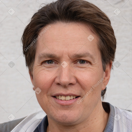 Joyful white adult male with short  brown hair and grey eyes