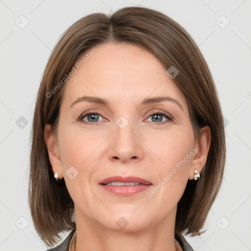 Joyful white adult female with medium  brown hair and grey eyes