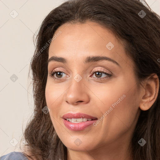 Joyful white young-adult female with long  brown hair and brown eyes