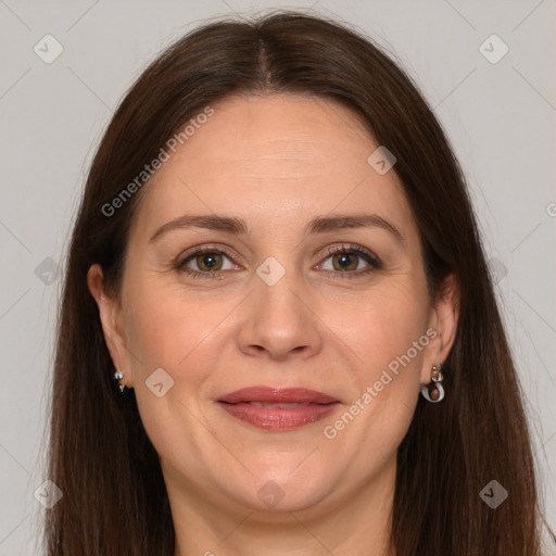 Joyful white adult female with long  brown hair and grey eyes