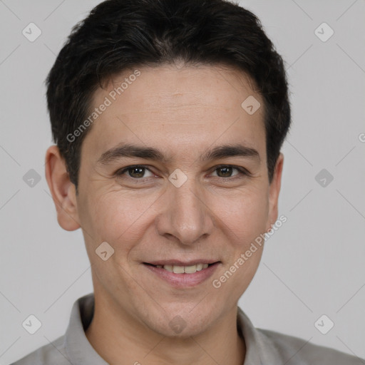 Joyful white adult male with short  brown hair and brown eyes