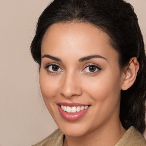 Joyful white young-adult female with medium  brown hair and brown eyes