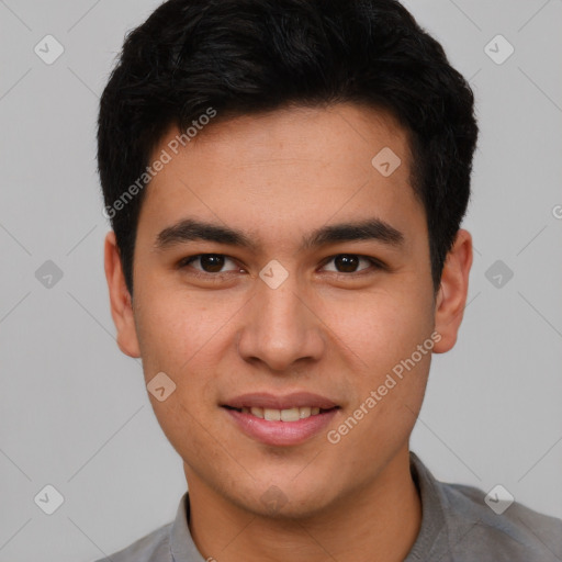 Joyful asian young-adult male with short  brown hair and brown eyes