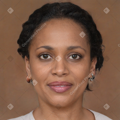 Joyful black adult female with short  brown hair and brown eyes