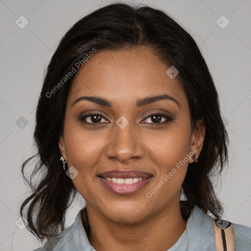 Joyful black young-adult female with medium  brown hair and brown eyes