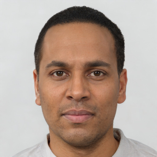 Neutral latino adult male with short  black hair and brown eyes