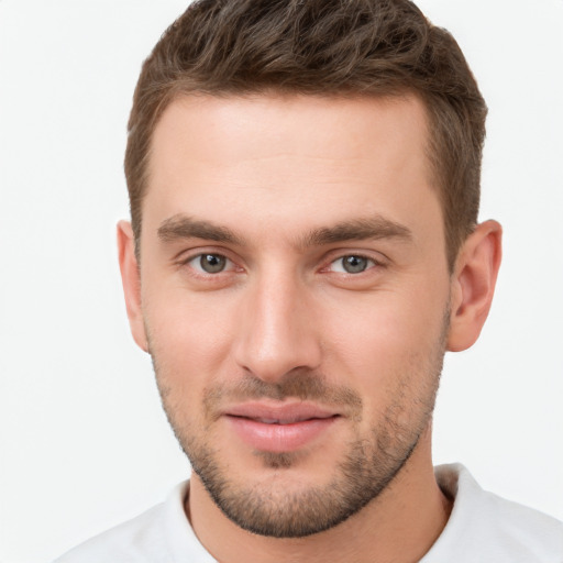 Joyful white young-adult male with short  brown hair and brown eyes