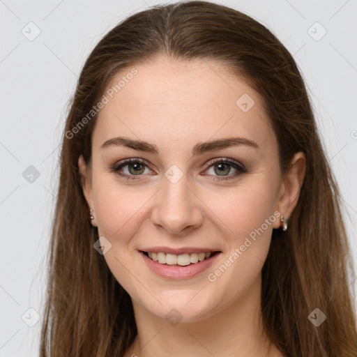 Joyful white young-adult female with long  brown hair and grey eyes