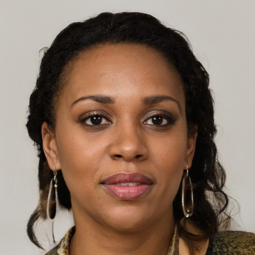 Joyful black young-adult female with medium  brown hair and brown eyes