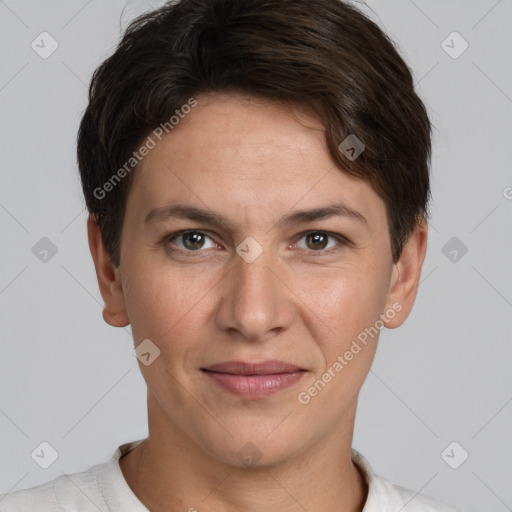 Joyful white adult female with short  brown hair and brown eyes