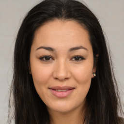 Joyful asian young-adult female with long  brown hair and brown eyes