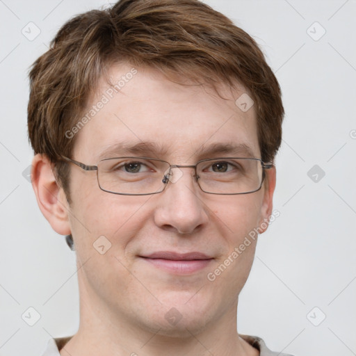 Joyful white adult male with short  brown hair and grey eyes