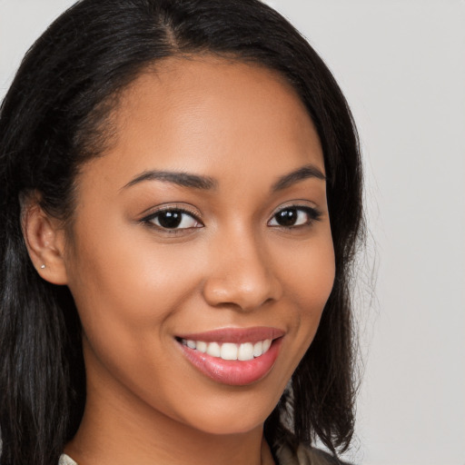 Joyful latino young-adult female with long  brown hair and brown eyes