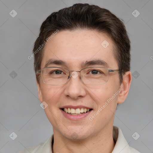 Joyful white adult male with short  brown hair and grey eyes