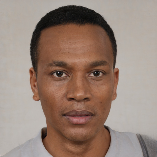 Neutral black young-adult male with short  black hair and brown eyes