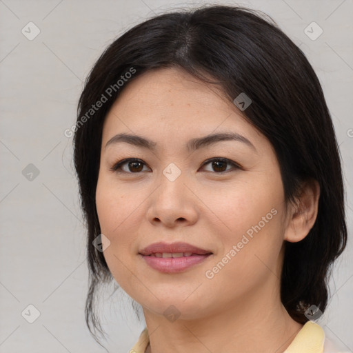 Joyful asian young-adult female with medium  brown hair and brown eyes