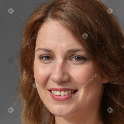 Joyful white adult female with long  brown hair and brown eyes