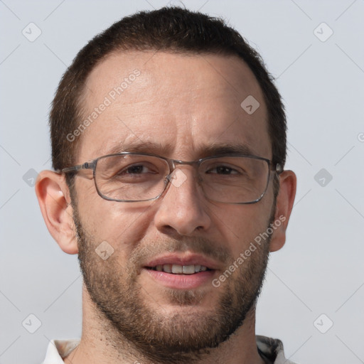 Joyful white adult male with short  brown hair and brown eyes