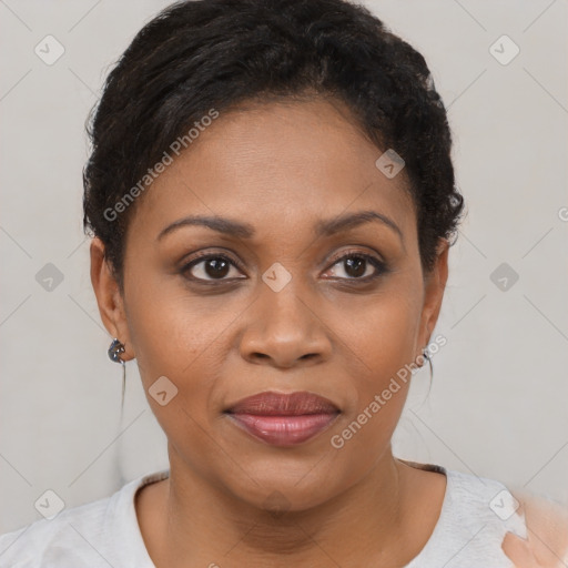 Joyful black young-adult female with short  brown hair and brown eyes