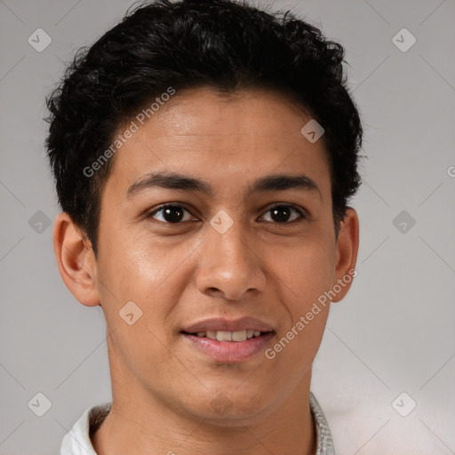 Joyful latino young-adult male with short  brown hair and brown eyes