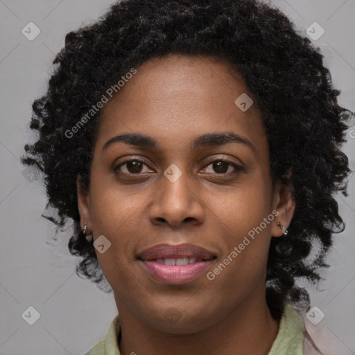 Joyful black young-adult female with long  brown hair and brown eyes