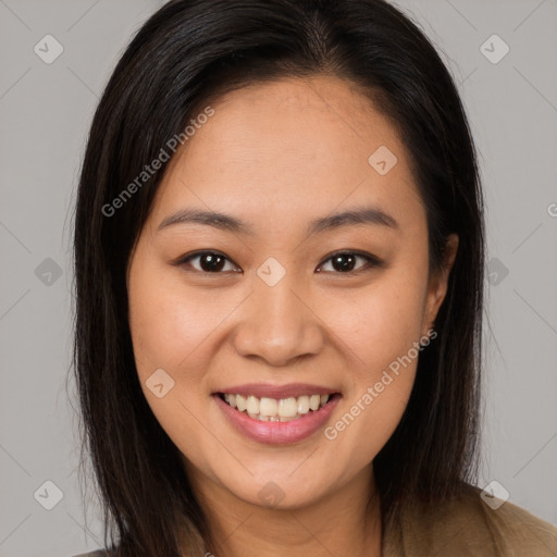 Joyful latino young-adult female with long  brown hair and brown eyes