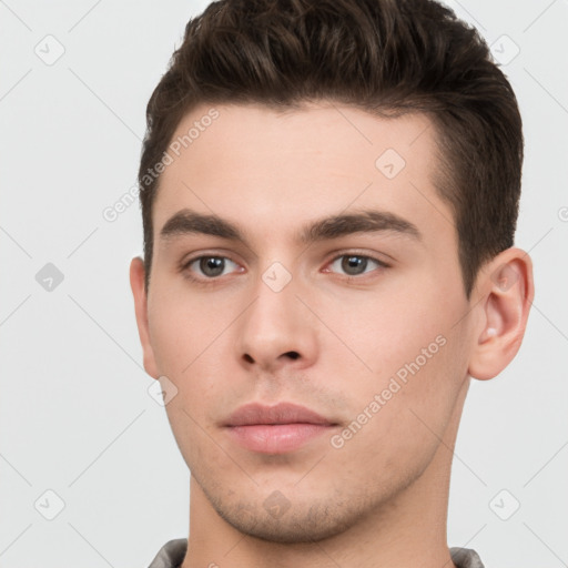 Neutral white young-adult male with short  brown hair and brown eyes