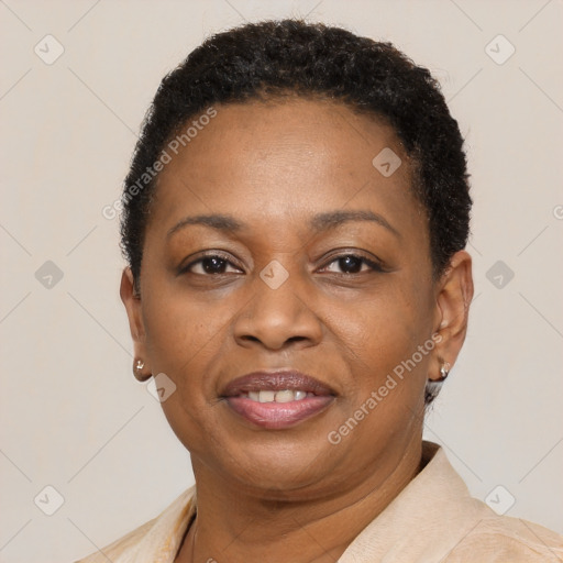 Joyful black adult female with short  brown hair and brown eyes