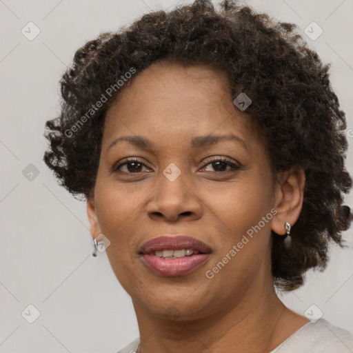 Joyful black adult female with short  brown hair and brown eyes