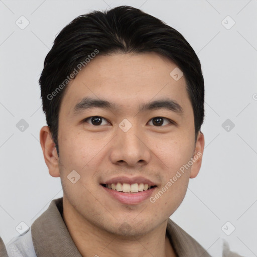 Joyful asian young-adult male with short  black hair and brown eyes