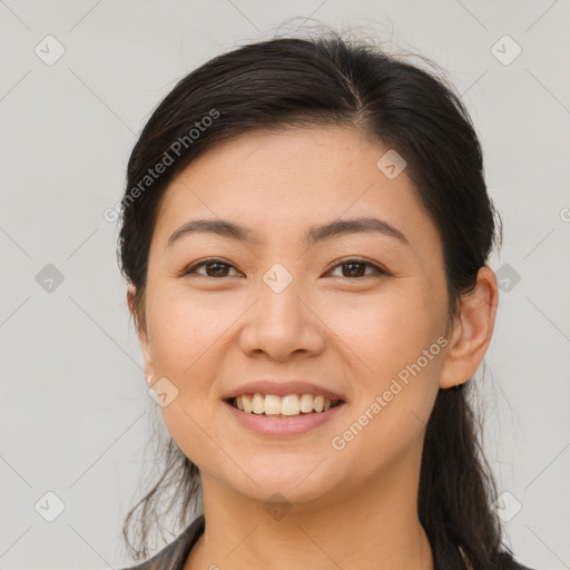 Joyful asian young-adult female with medium  brown hair and brown eyes