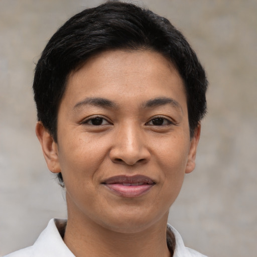 Joyful asian young-adult female with short  black hair and brown eyes