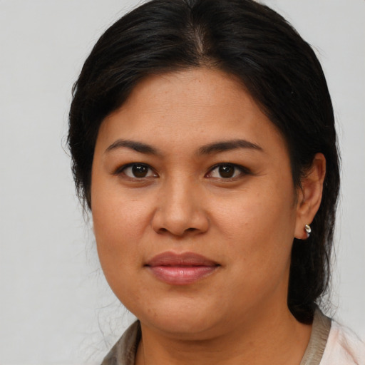 Joyful asian young-adult female with medium  brown hair and brown eyes