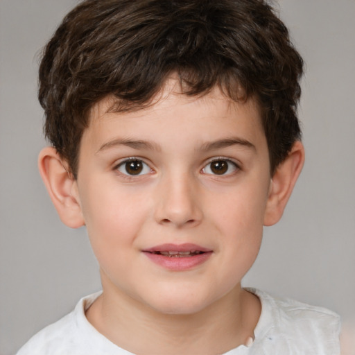 Joyful white child male with short  brown hair and brown eyes