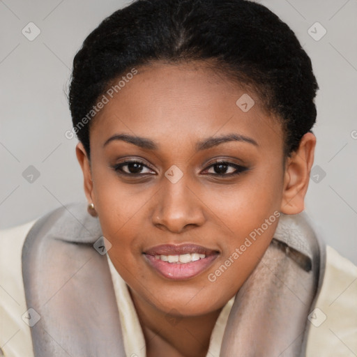 Joyful black young-adult female with short  brown hair and brown eyes