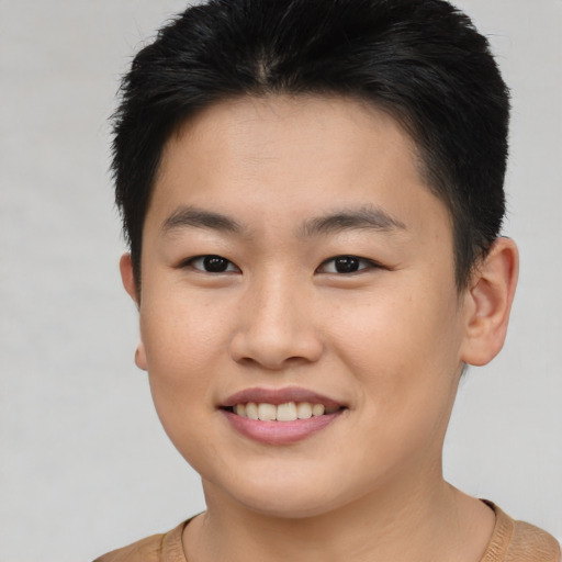Joyful asian young-adult female with short  brown hair and brown eyes