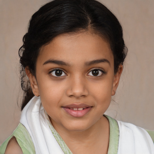 Joyful latino child female with medium  brown hair and brown eyes